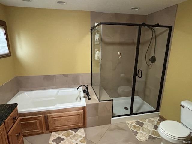 full bathroom with vanity, plus walk in shower, and toilet