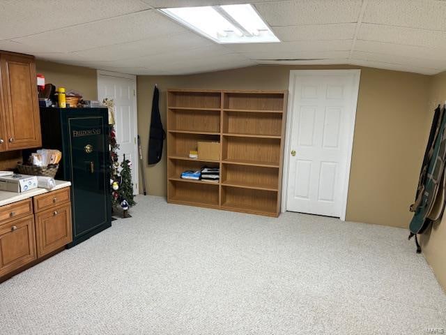 interior space with light colored carpet and vaulted ceiling