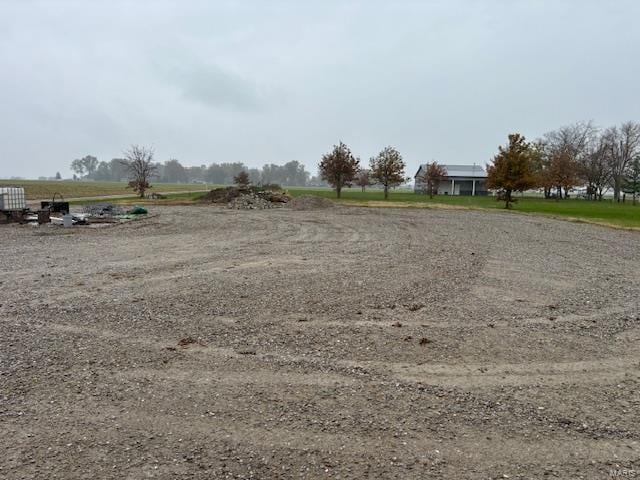 view of yard with a rural view