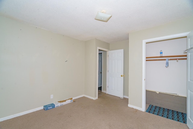 unfurnished bedroom featuring light carpet and a closet