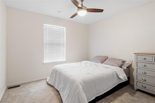 bedroom with ceiling fan and light colored carpet