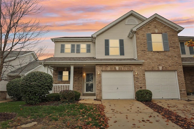 view of front facade featuring a porch and a garage