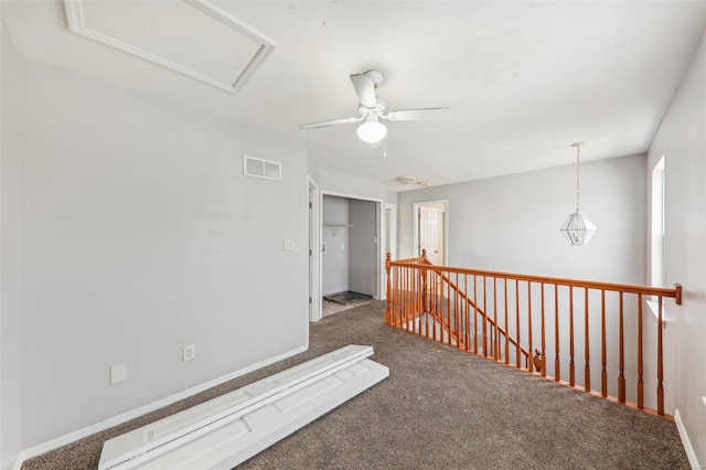 interior space featuring carpet and ceiling fan