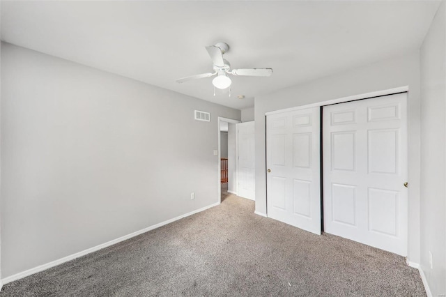 unfurnished bedroom with ceiling fan, a closet, and carpet floors