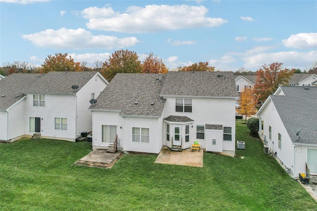 rear view of house with a yard, a patio area, and central air condition unit