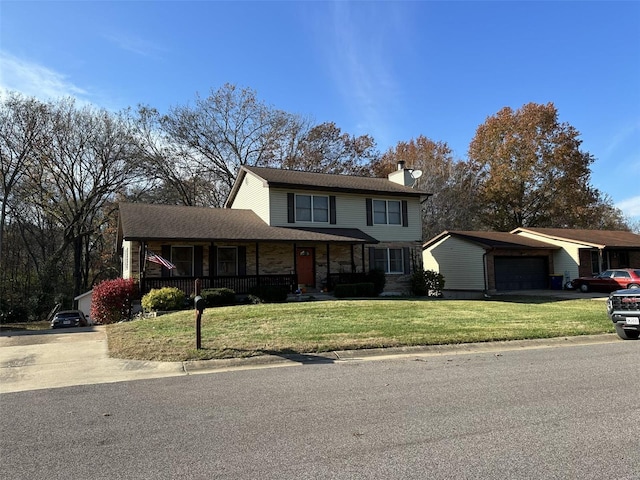 front facade featuring a garage, covered porch, and a front lawn