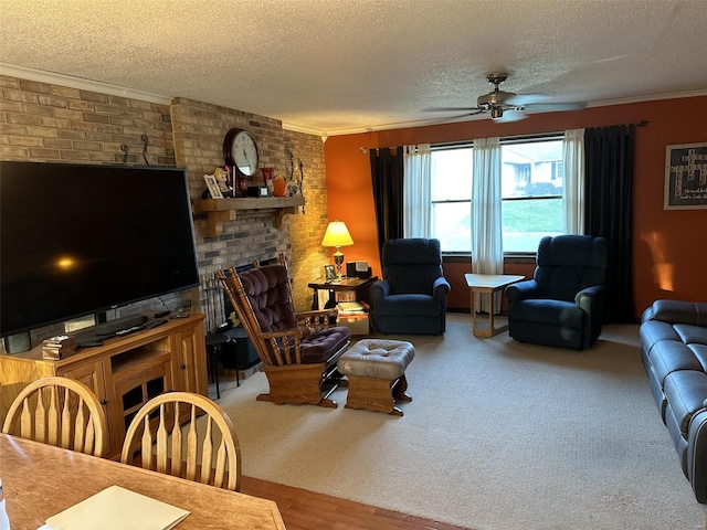 living room with hardwood / wood-style flooring, ceiling fan, a textured ceiling, and ornamental molding