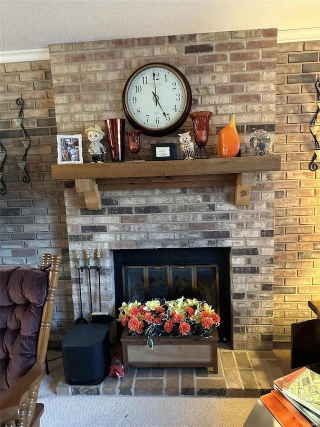 interior details featuring a fireplace and a textured ceiling