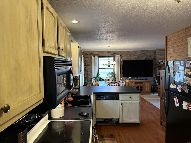 kitchen with dark hardwood / wood-style floors, a chandelier, a textured ceiling, pendant lighting, and black appliances