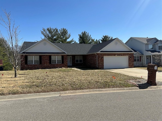 ranch-style house with a garage, brick siding, and concrete driveway