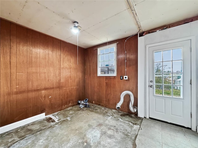 interior space featuring wooden walls