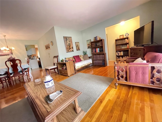 living room featuring hardwood / wood-style floors and a chandelier