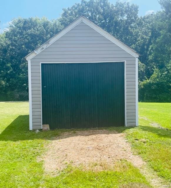 garage with a lawn