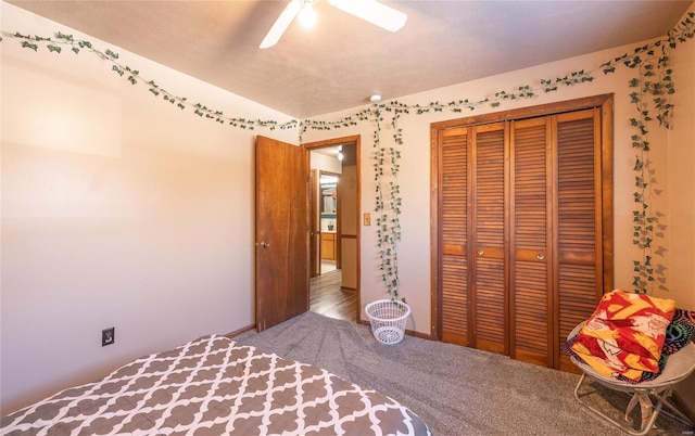 unfurnished bedroom featuring carpet floors, a closet, and ceiling fan