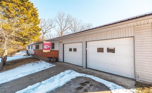 view of snow covered garage