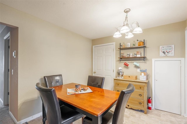 dining room featuring a notable chandelier