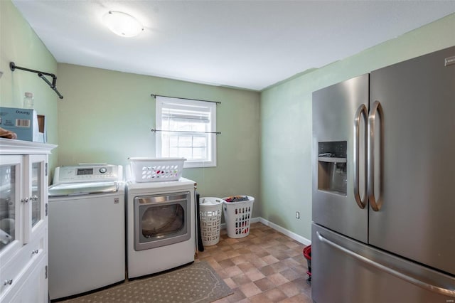 clothes washing area featuring washer and dryer