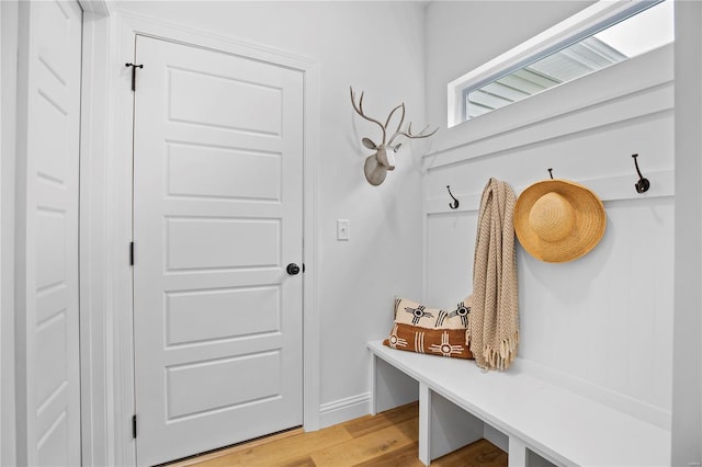 mudroom with light hardwood / wood-style flooring