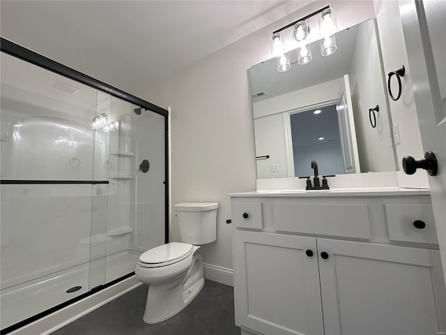 bathroom with vanity, toilet, and a shower with shower door