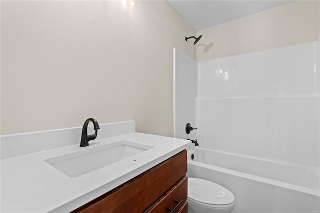 full bathroom featuring shower / tub combination, vanity, and toilet