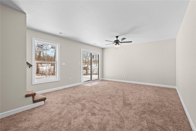 carpeted empty room with ceiling fan