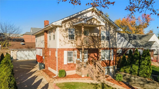 view of front of home featuring a balcony and a garage