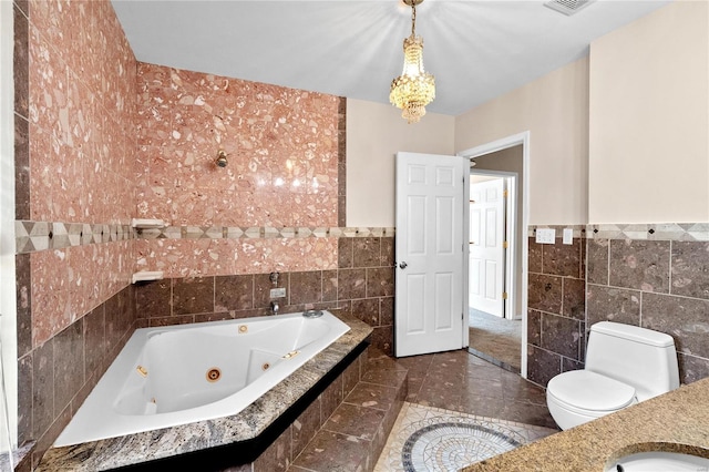 bathroom featuring a relaxing tiled tub, tile patterned floors, and tile walls