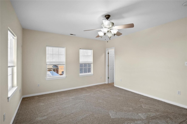 unfurnished room with carpet flooring and ceiling fan