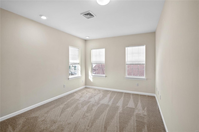 spare room with carpet floors