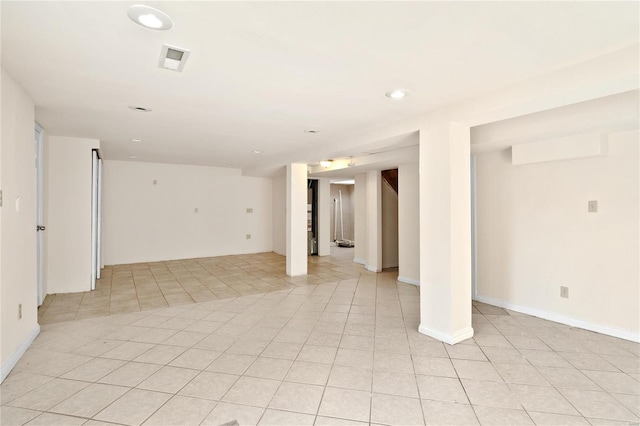 spare room featuring light tile patterned floors