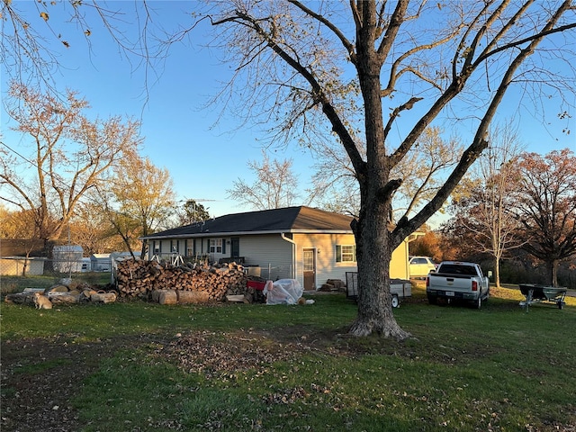 view of side of property featuring a yard