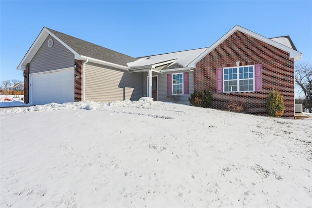 view of front of property with a garage and central air condition unit