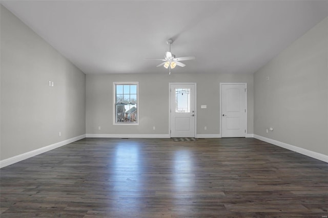 unfurnished room with dark wood-type flooring and ceiling fan