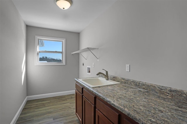 washroom with washer hookup, dark hardwood / wood-style floors, electric dryer hookup, and sink