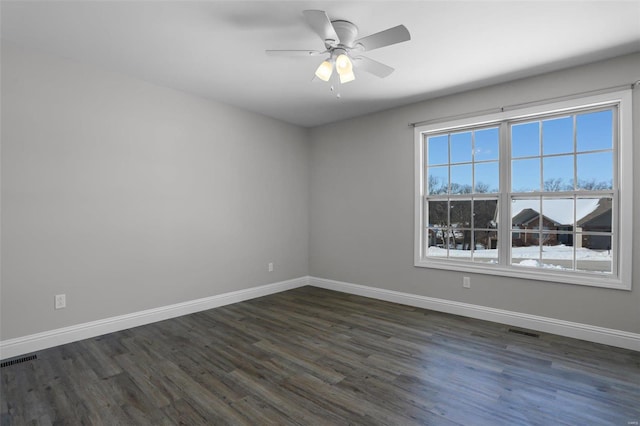 unfurnished room featuring ceiling fan and dark wood-type flooring