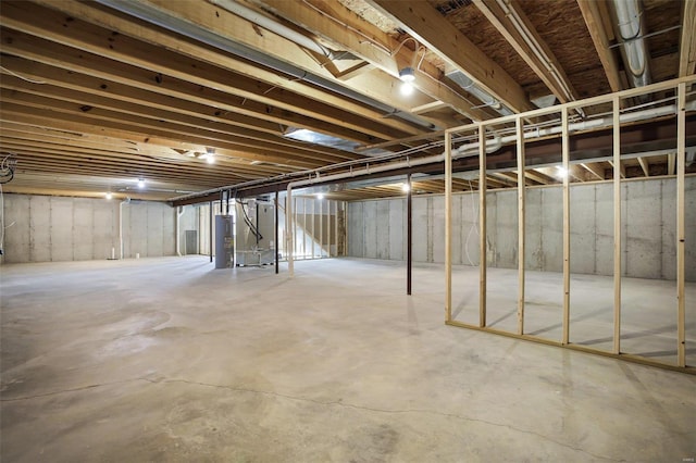 basement with water heater and heating unit