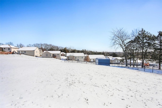 view of yard layered in snow