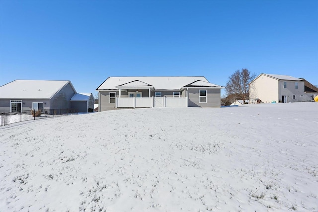 view of snow covered house