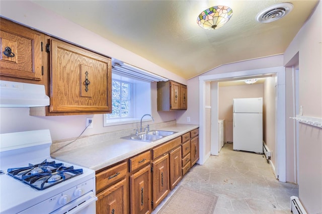 kitchen with a baseboard heating unit, white appliances, sink, and vaulted ceiling