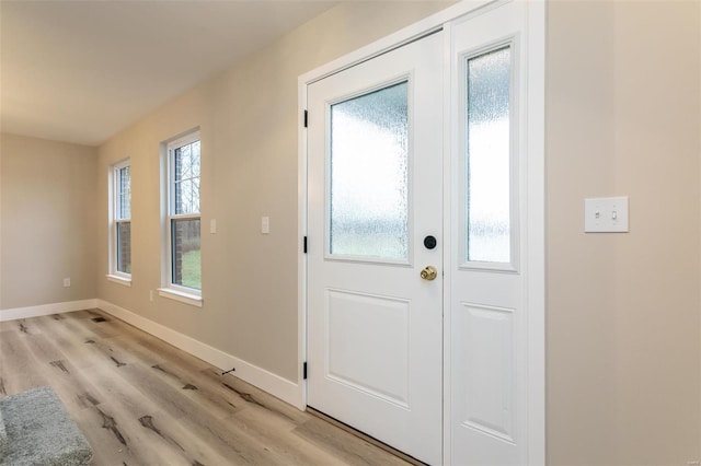 doorway with light wood-type flooring