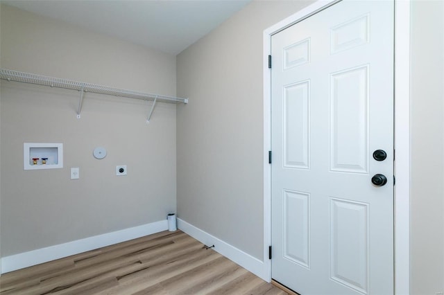 laundry area with hookup for an electric dryer, hookup for a gas dryer, hookup for a washing machine, and light wood-type flooring