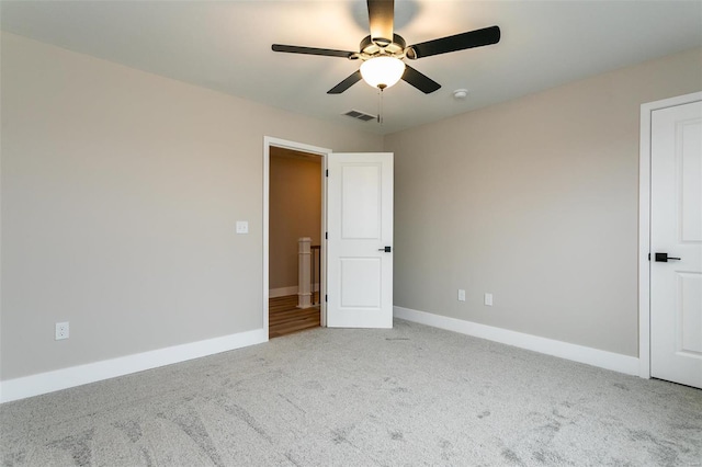 unfurnished bedroom with light carpet and ceiling fan