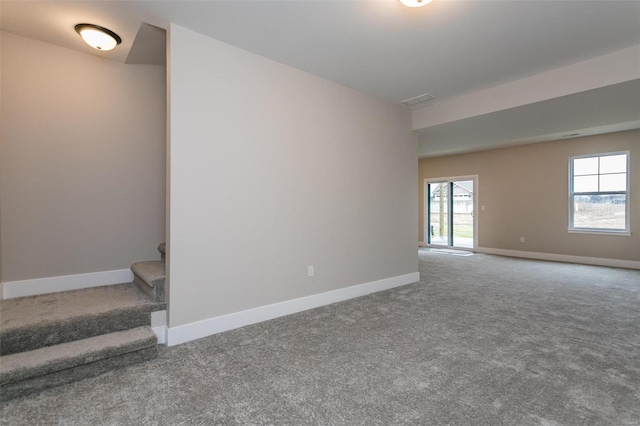 unfurnished room featuring carpet