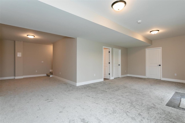 basement featuring light colored carpet