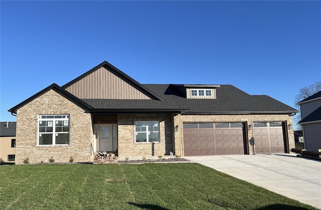 view of front of house with a garage and a front lawn