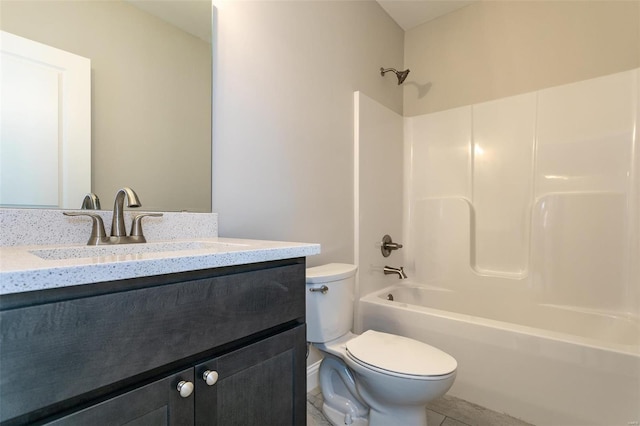 full bathroom with toilet, vanity, and shower / washtub combination