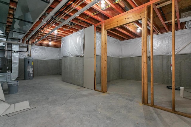 basement with electric water heater and heating unit