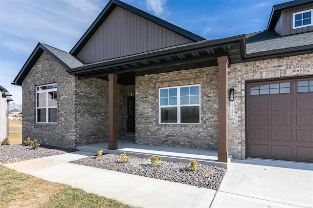 view of front of home with a garage and a porch