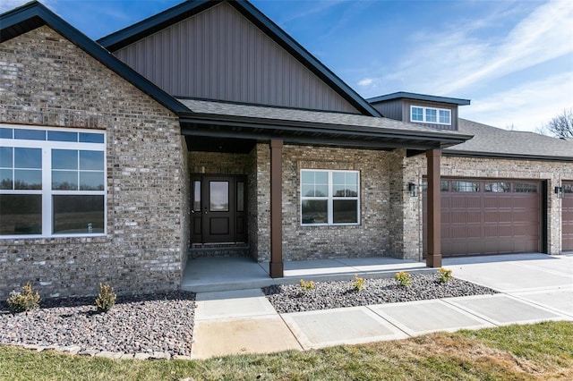 view of front of property with a porch and a garage