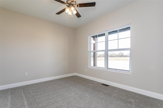 carpeted empty room featuring ceiling fan